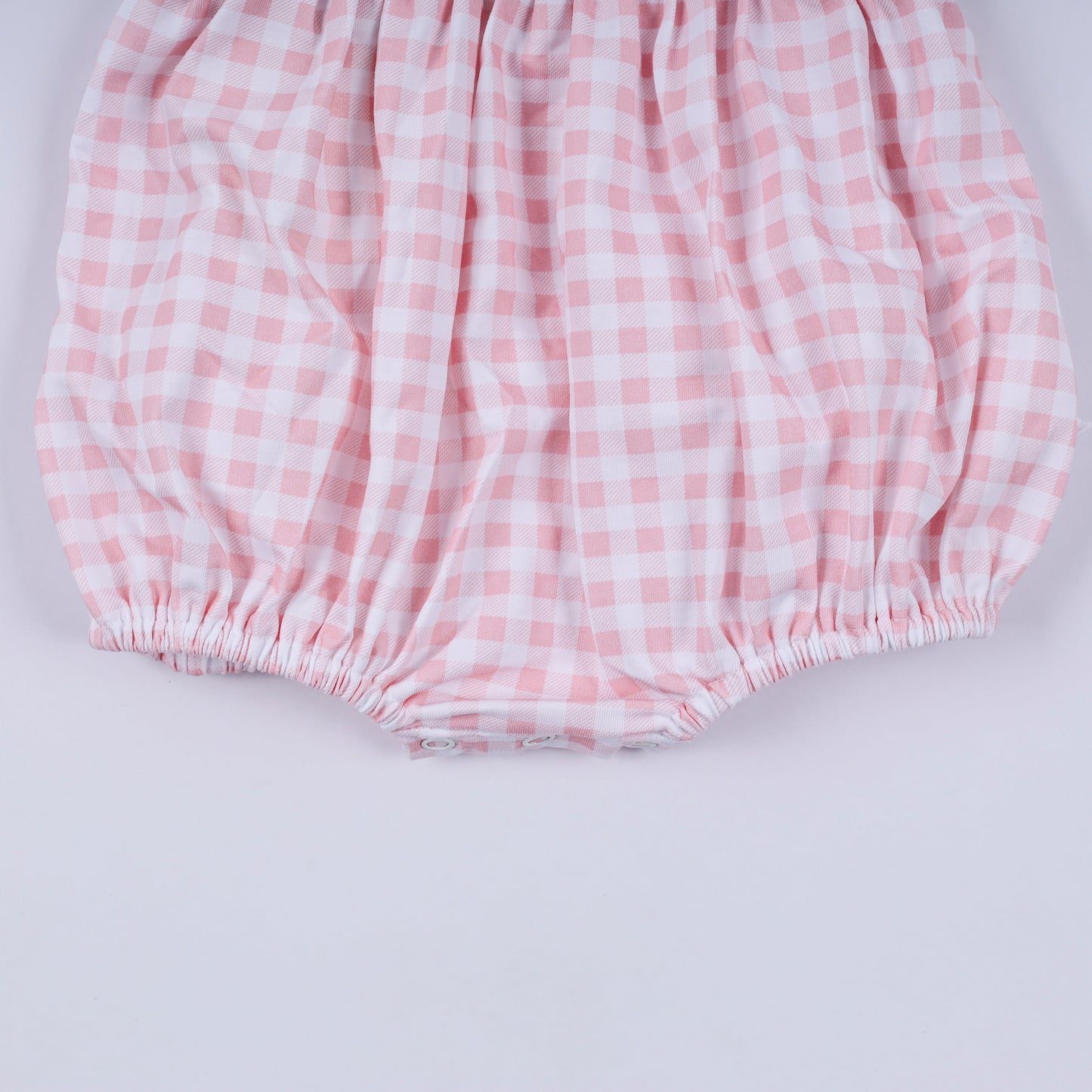 Pink character hand smocked gingham ruffle bubble